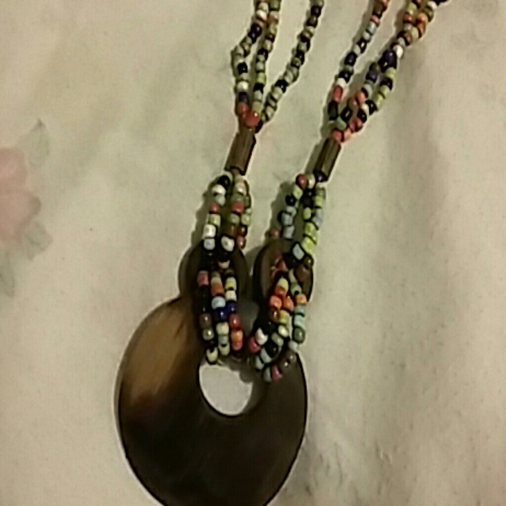 NECKLACE BEADS AND CARVED  WOODEN DECO.